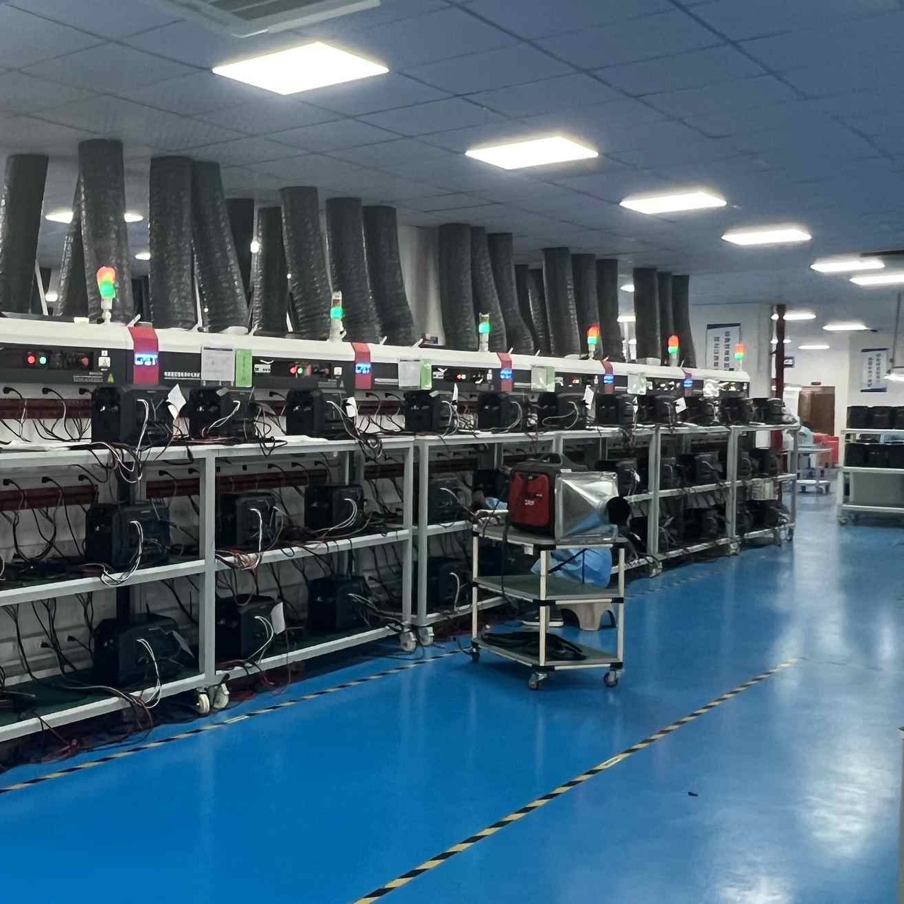 Finished-product aging racks: units run on load before shipment